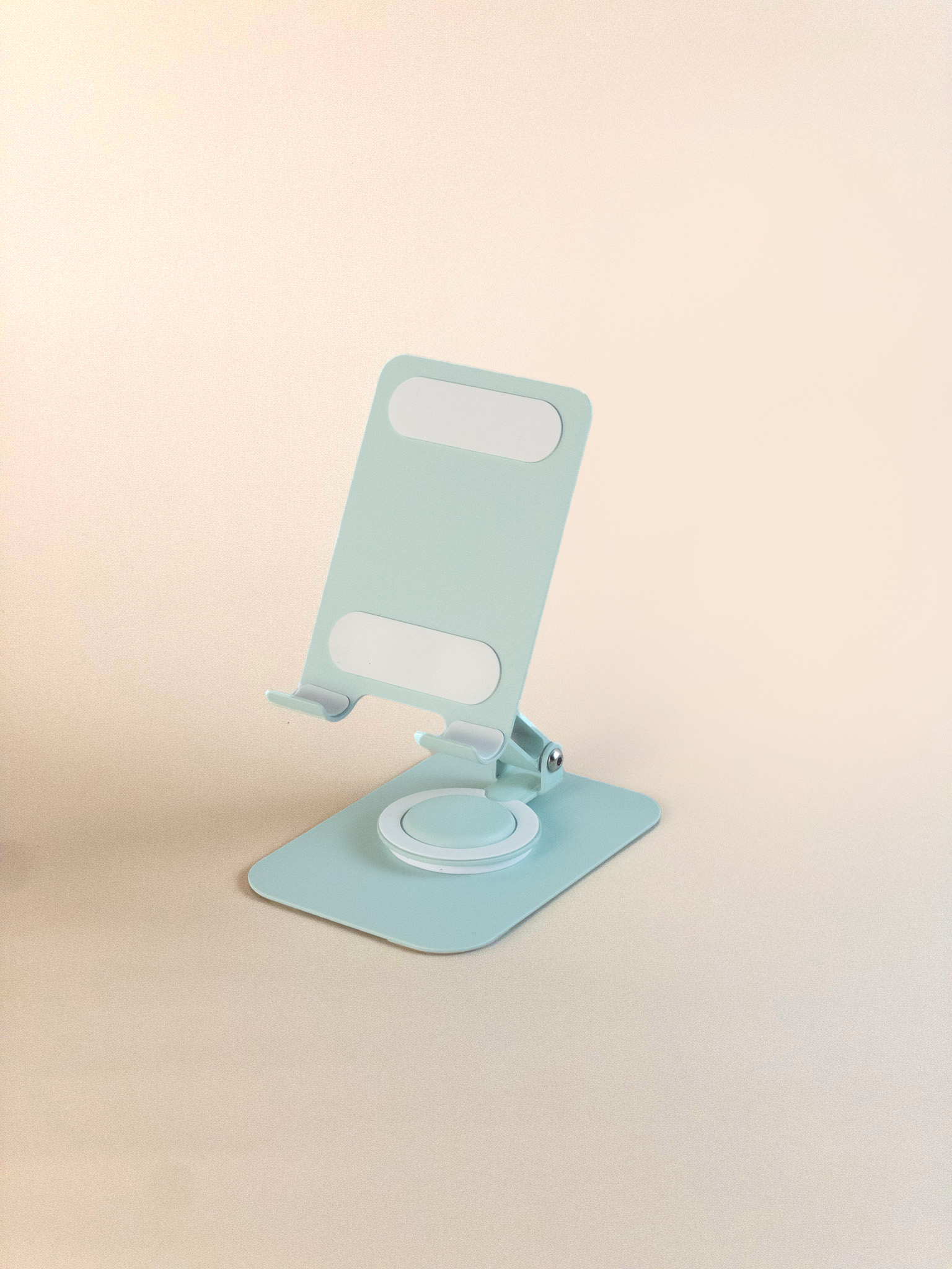 Green phone holder on a beige background