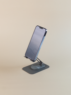 Phone on a stand against a beige background