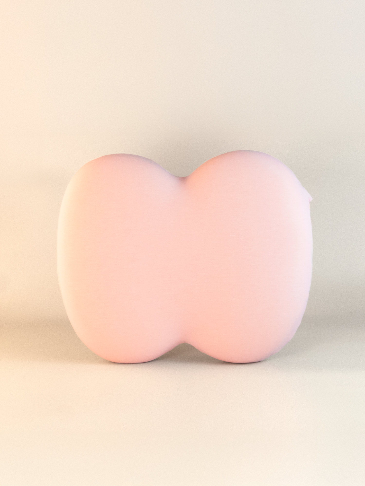 Pink pillow seat on a beige background