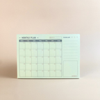 Monthly planner with a minimal design on a beige background