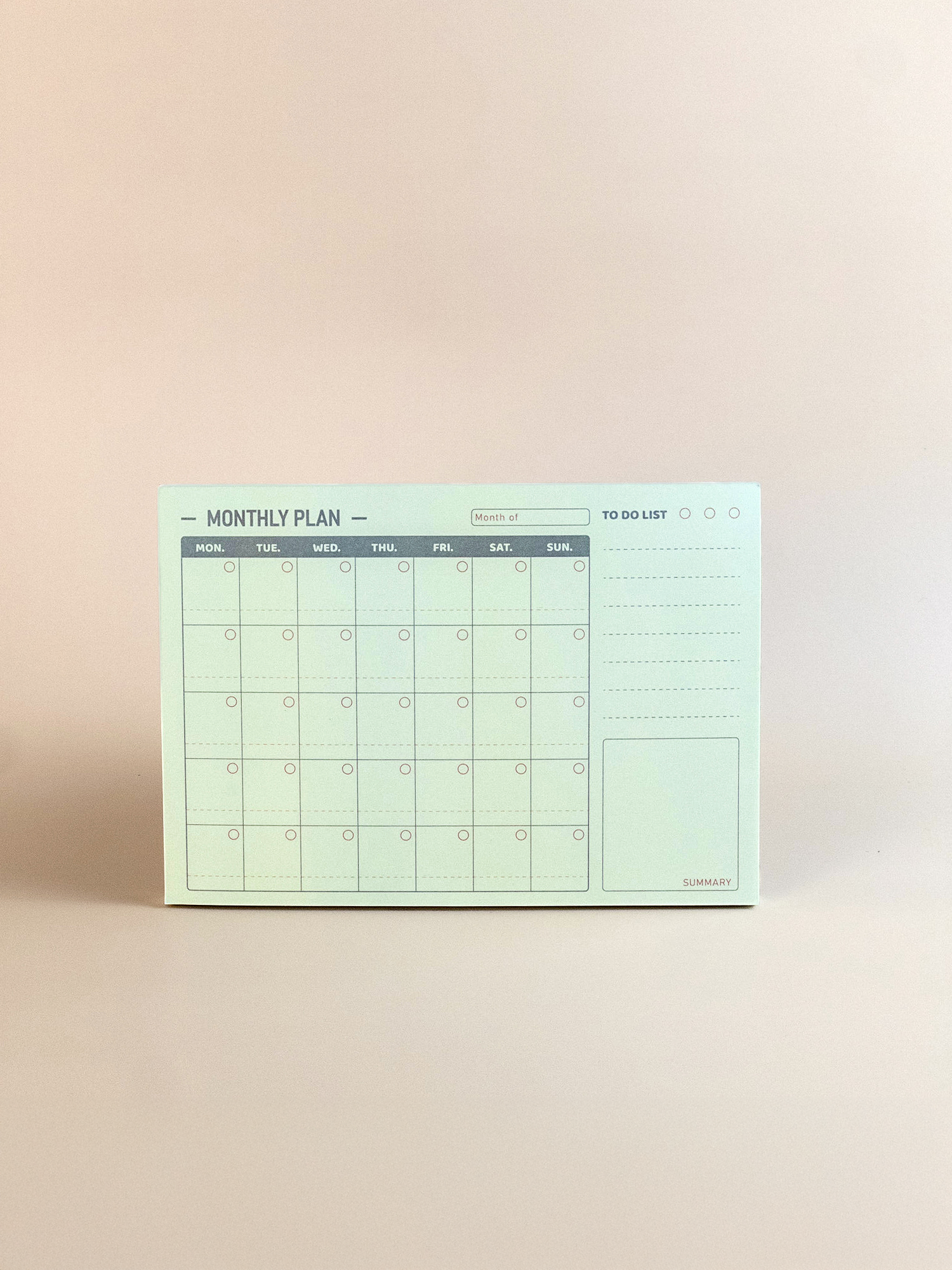 Monthly planner with a minimal design on a beige background