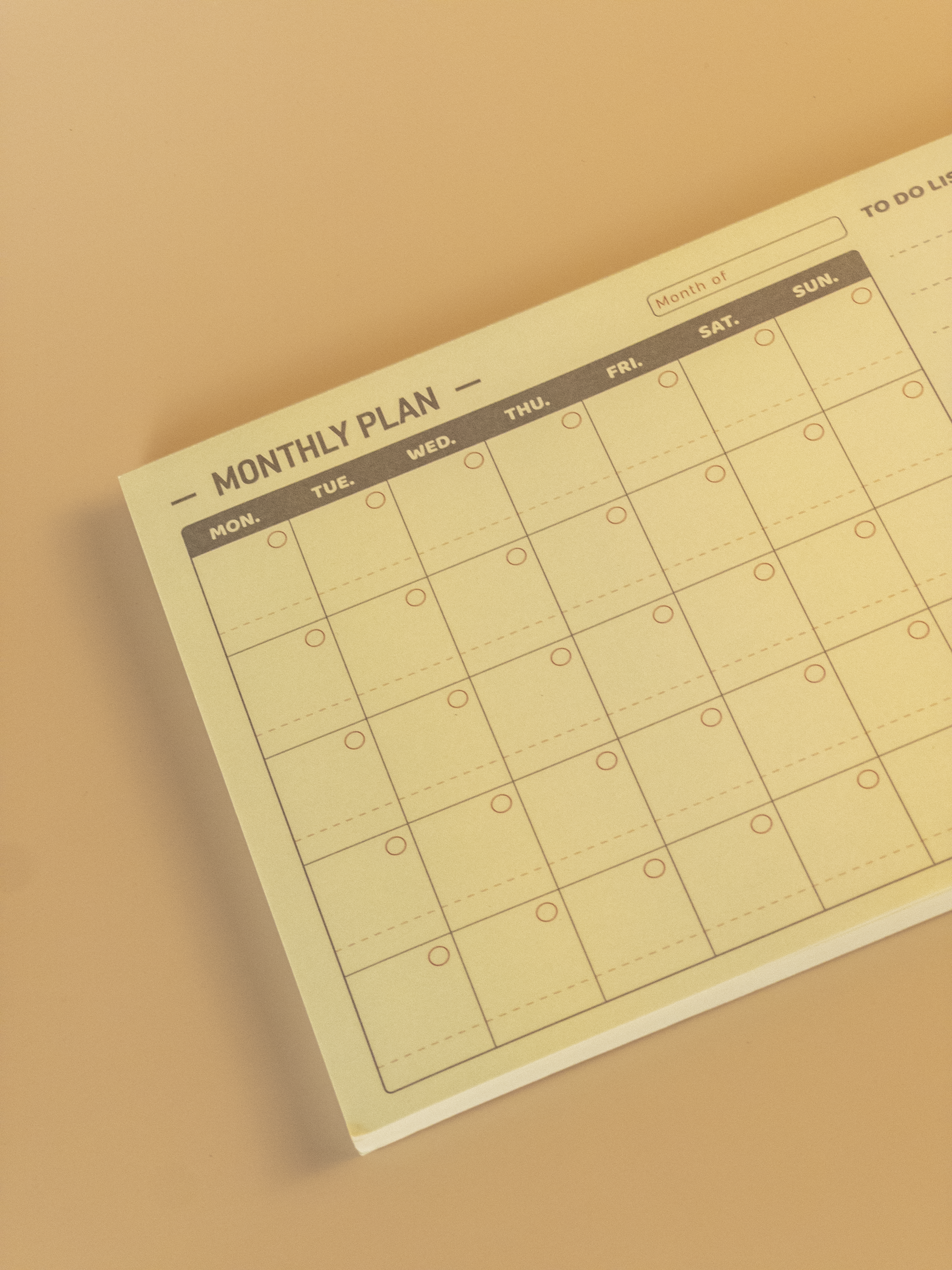 Minimalist design monthly plan calendar notepad on a beige background