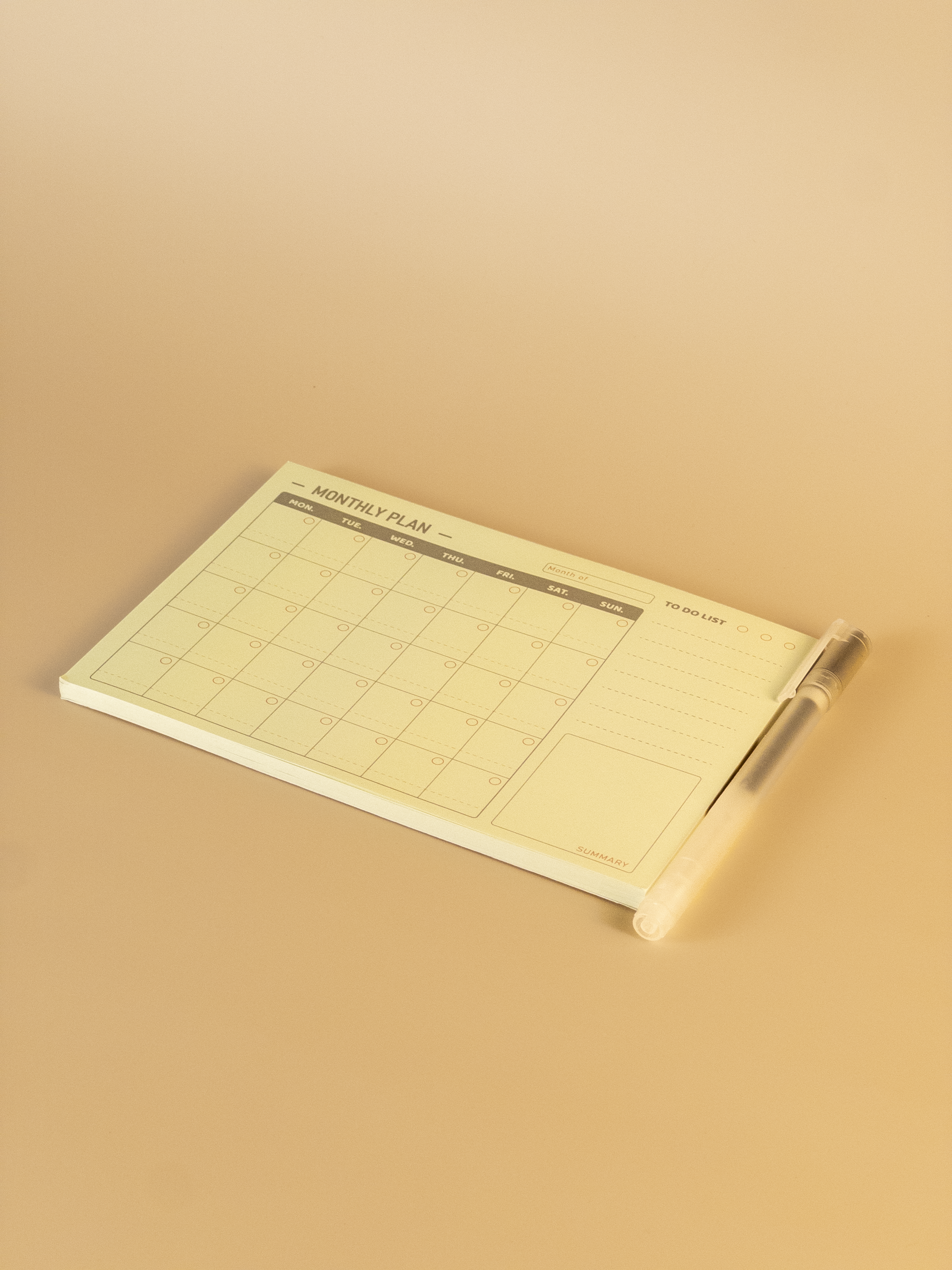 Notebook with grid layout on a beige background