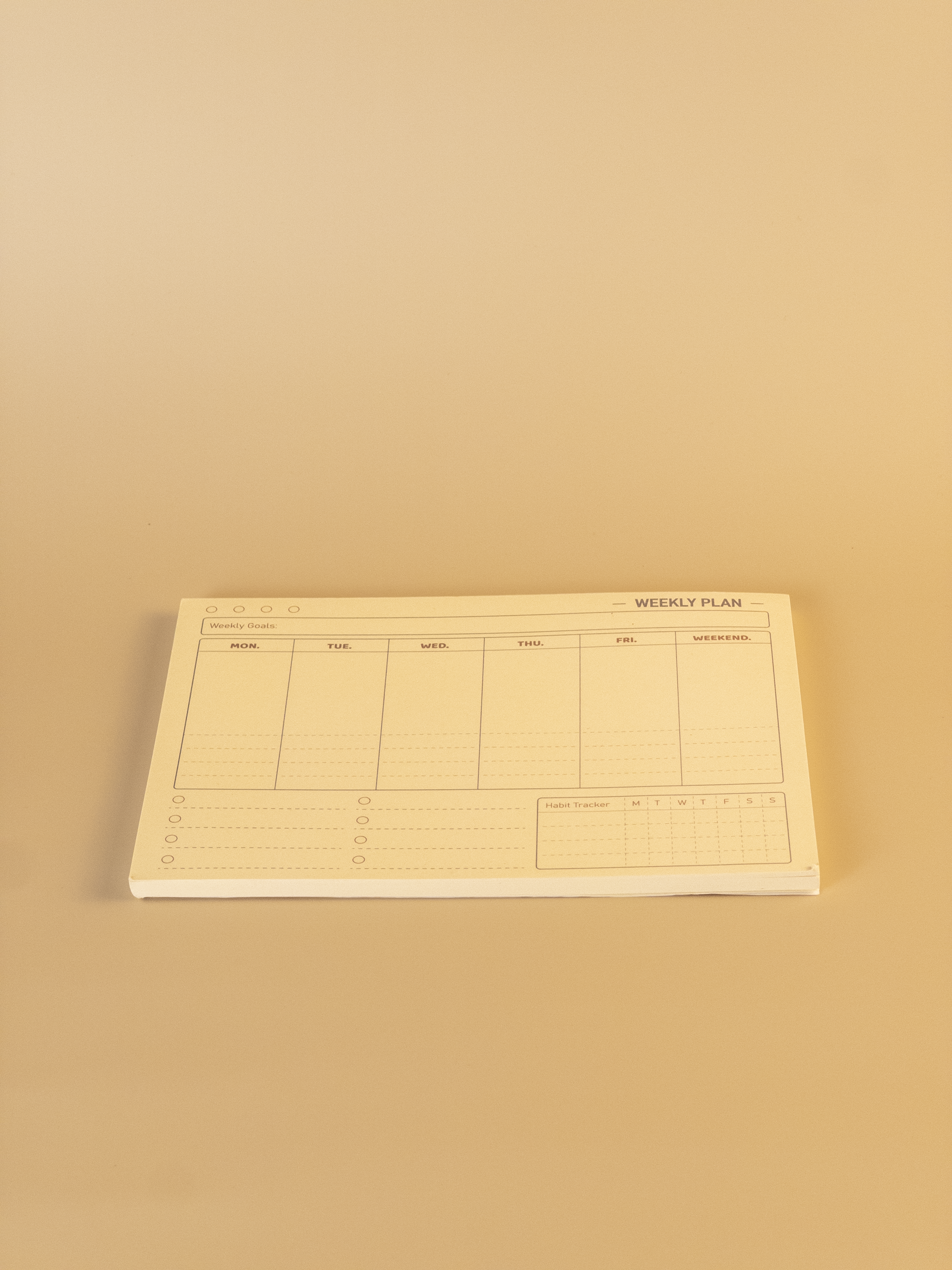 Weekly plan sheet on a beige background