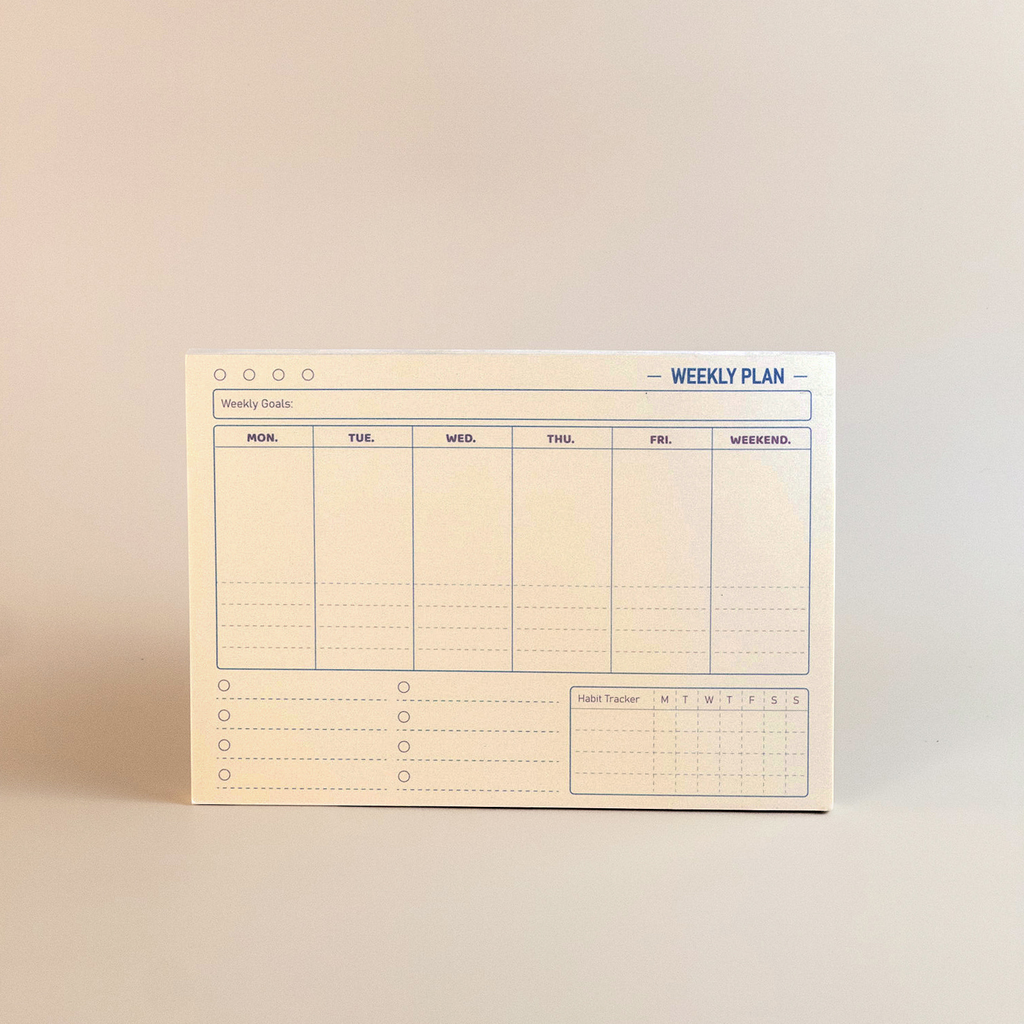 Weekly plan pad on a beige background
