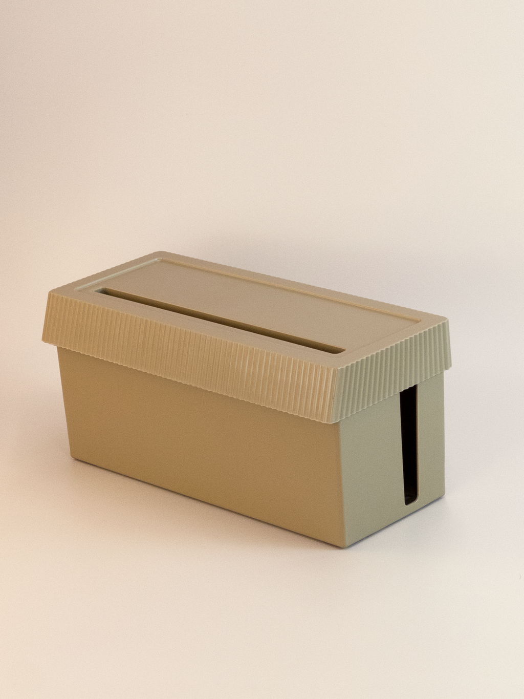 Beige cardboard box with a slot on a beige background