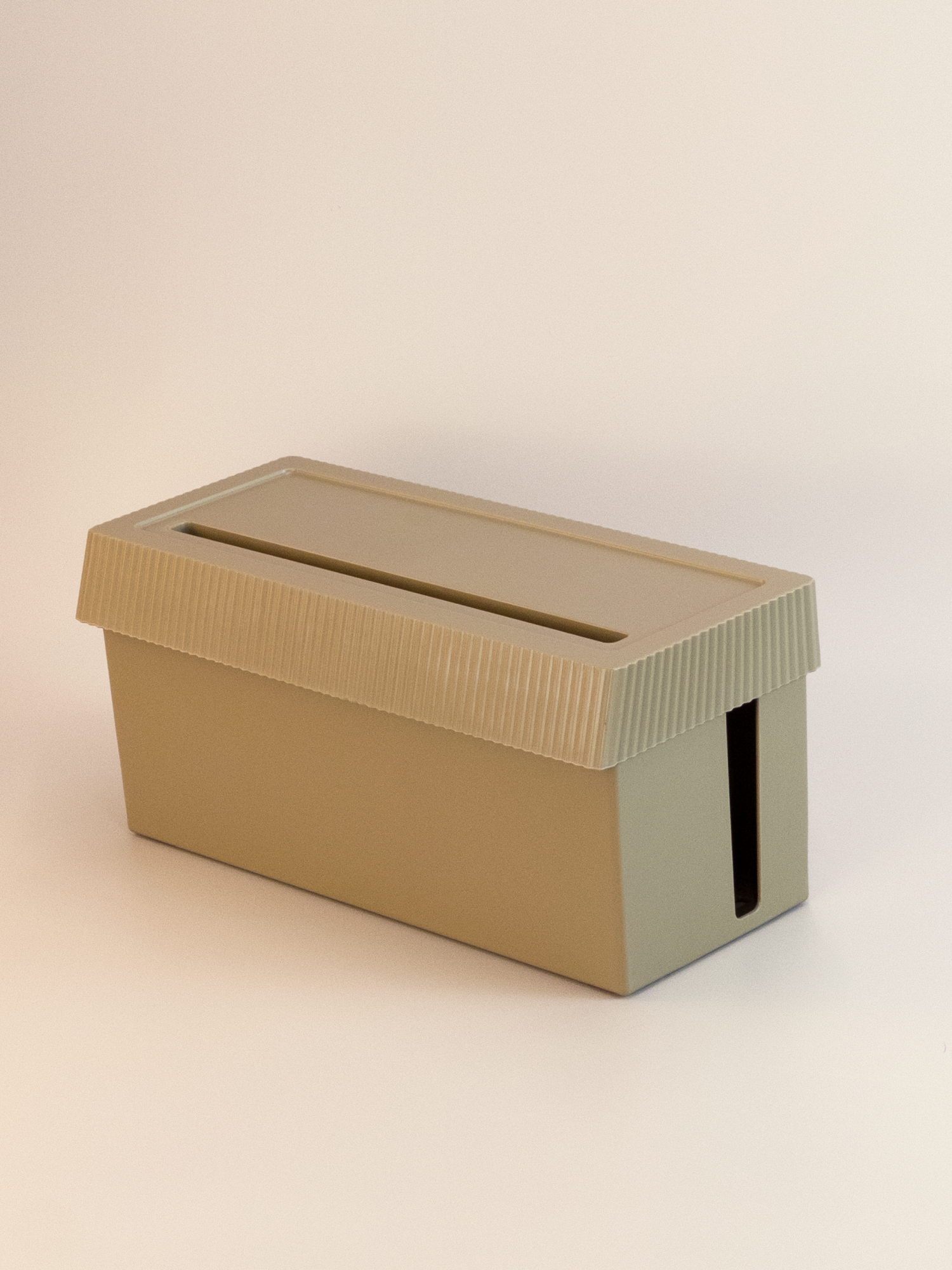 Beige cardboard box with a slot on a beige background
