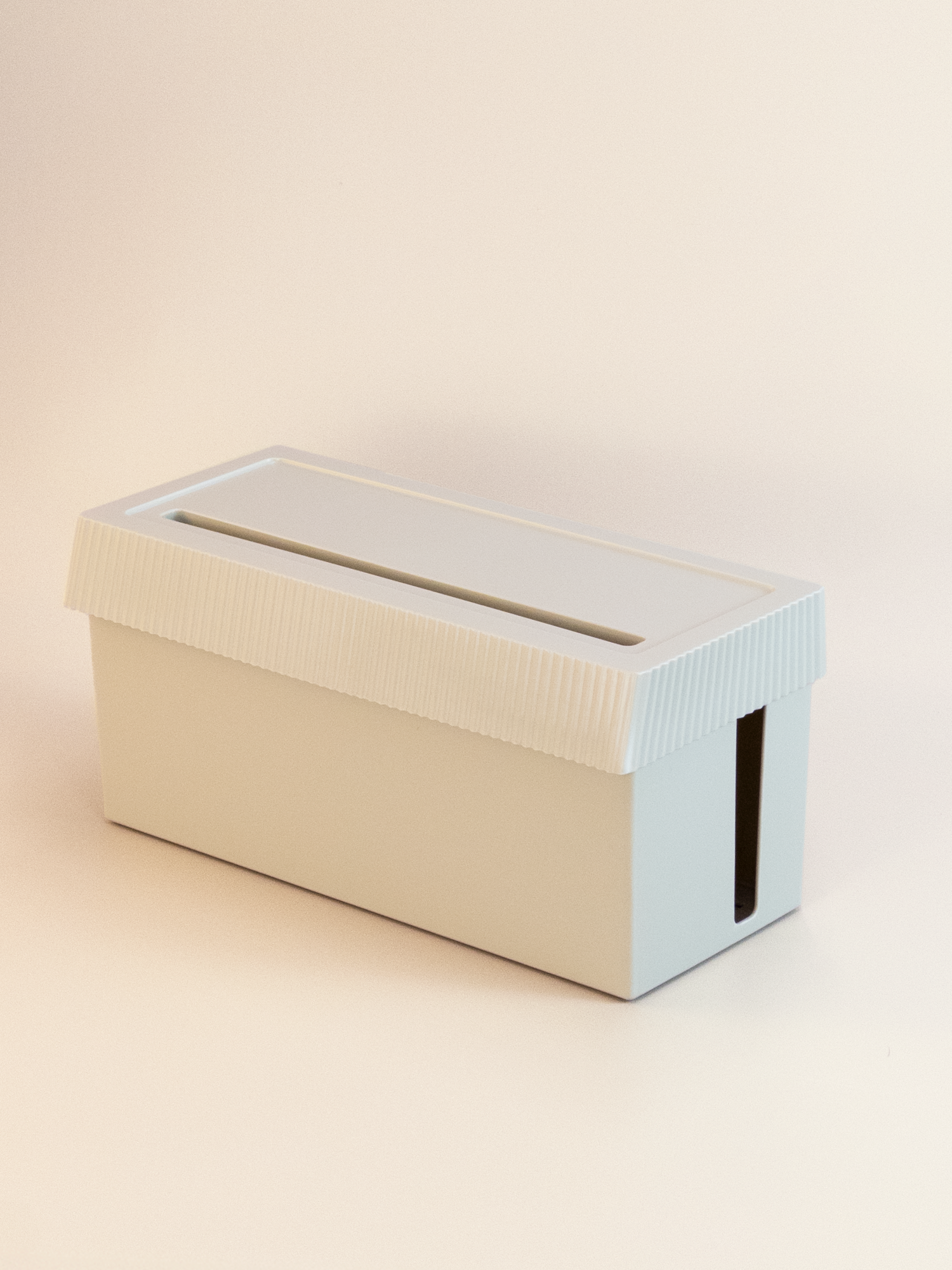 Gray Cable Management Box with Lid box on a beige background