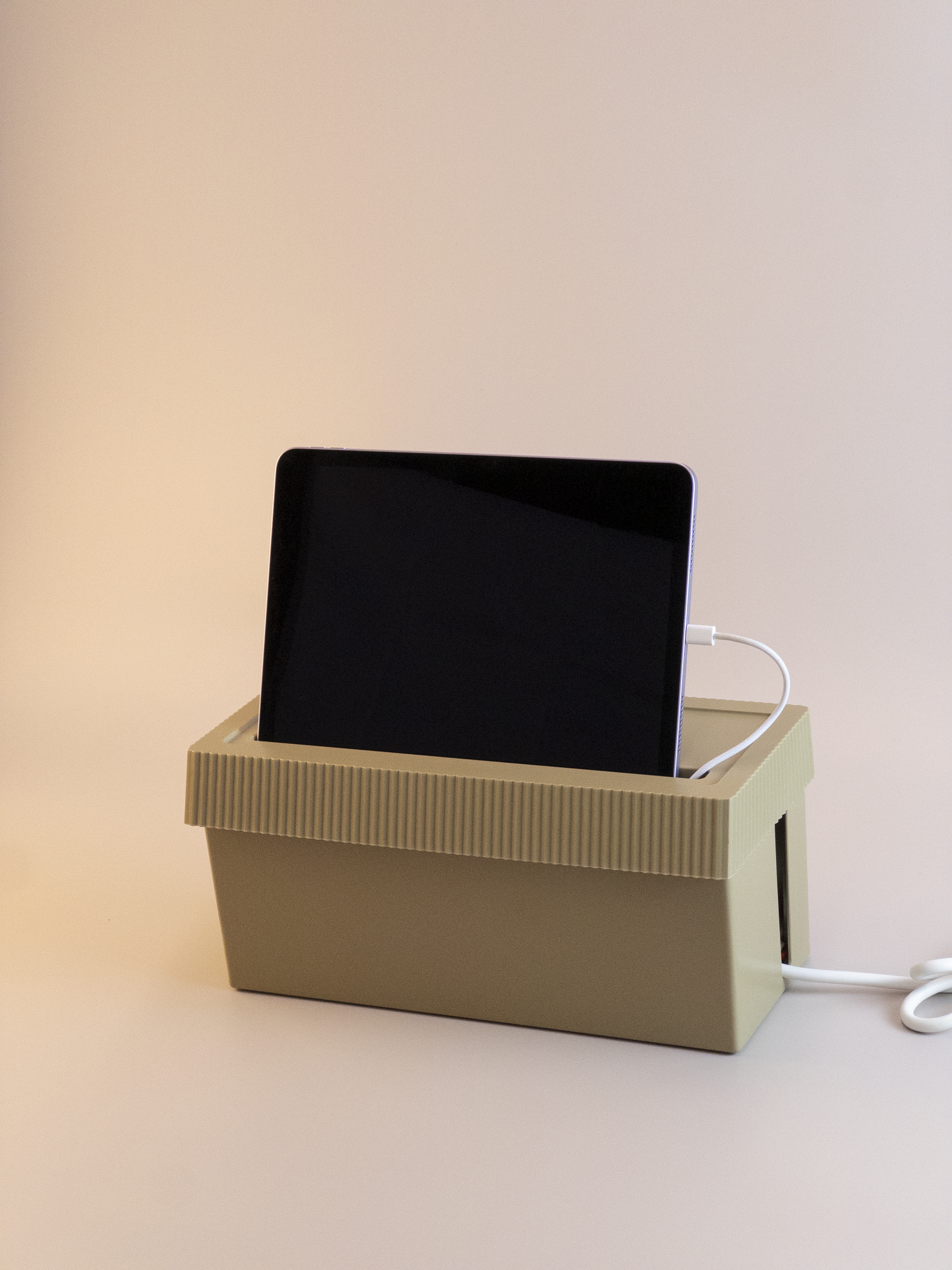 Cable Management Box with Lid with ipad  and cables on a beige background