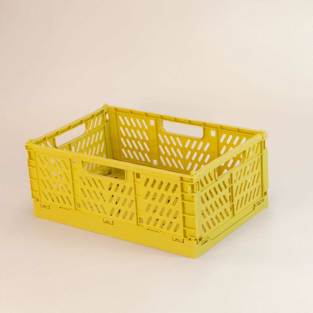Yellow crate on a beige background