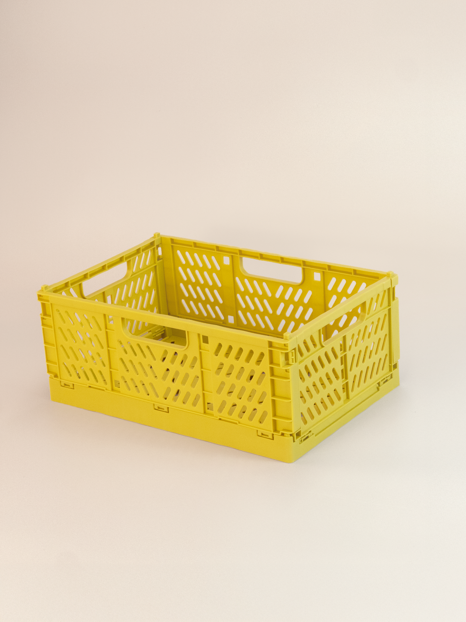 Yellow crate on a beige background