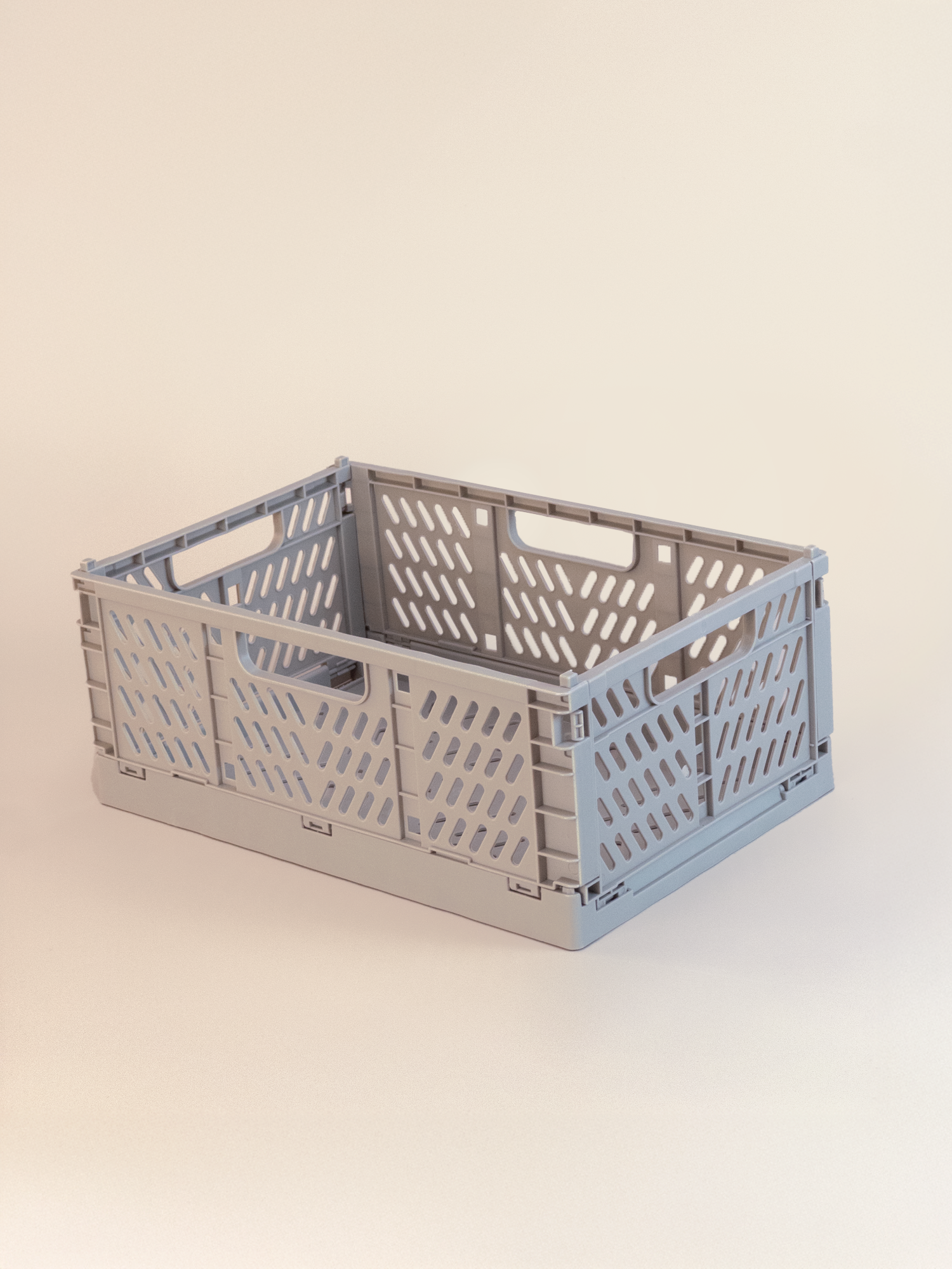 Gray storage crate on a beige background