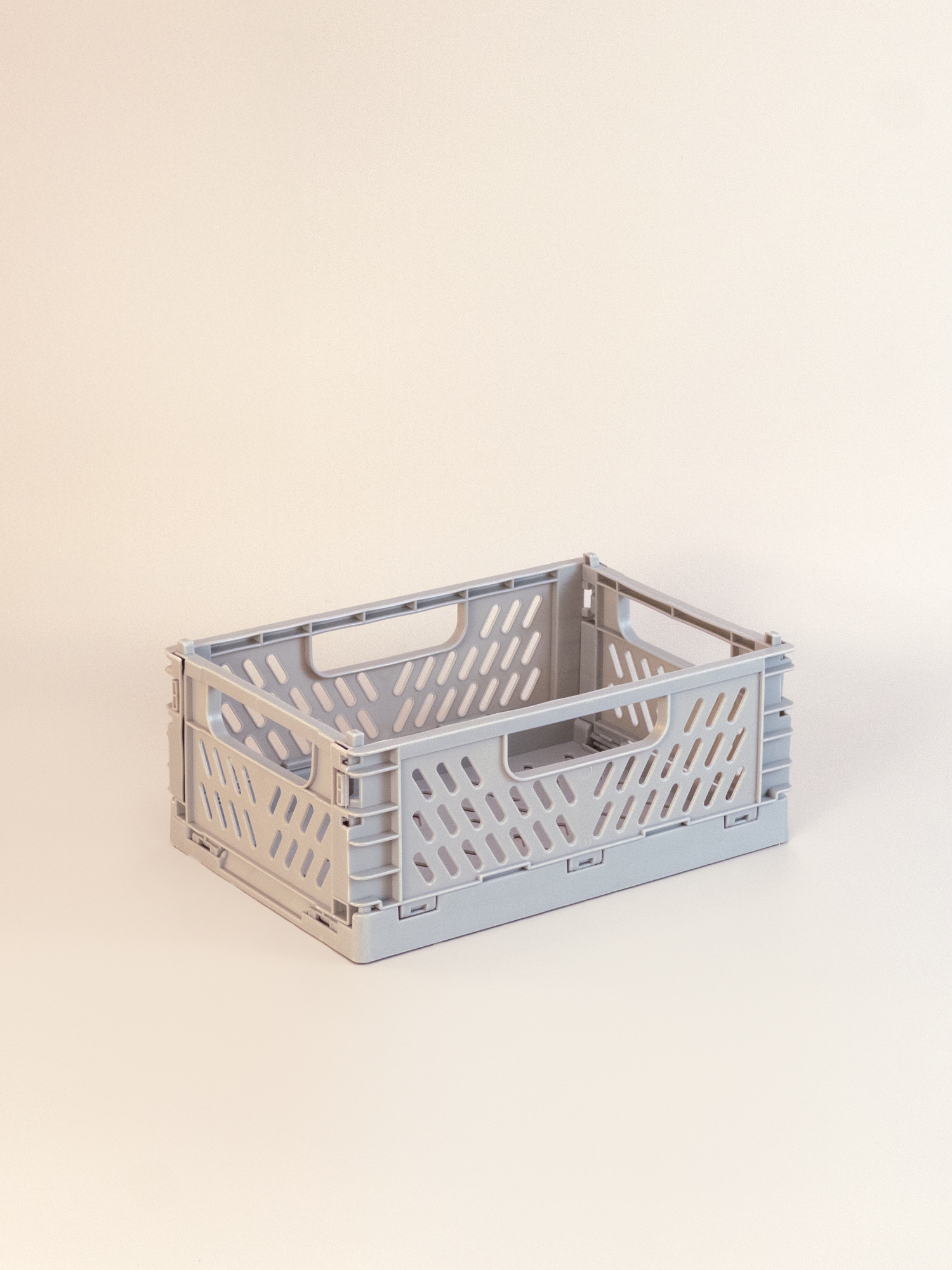 Gray storage crate on a beige background