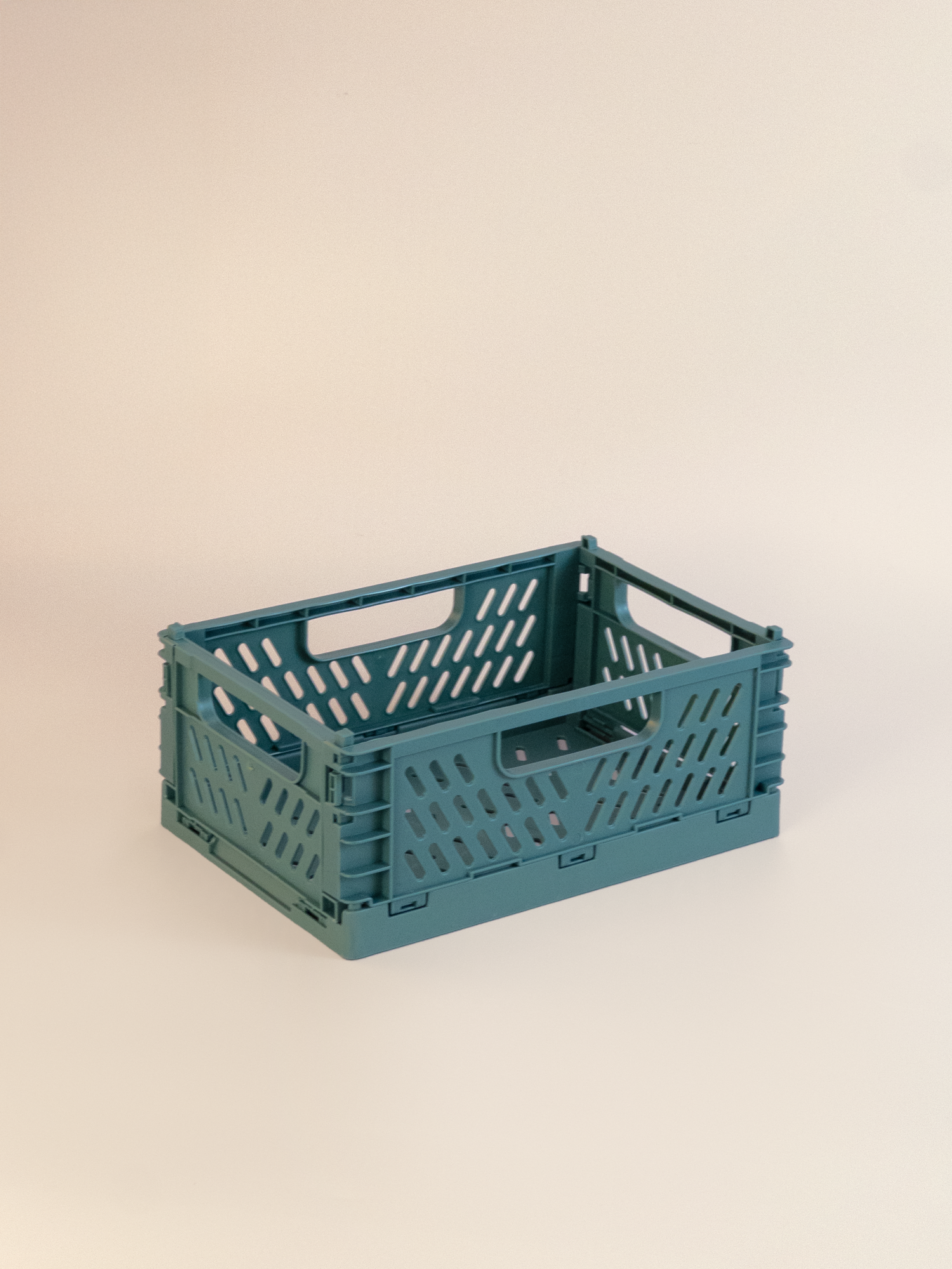 green crate on a beige background