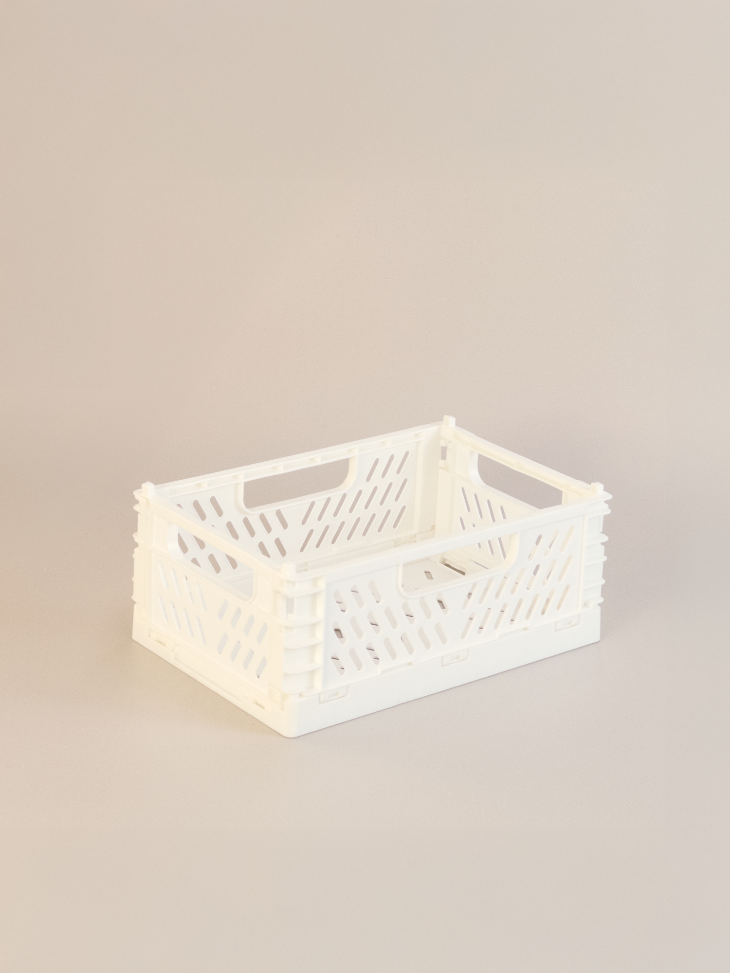 White storage crate on a beige background