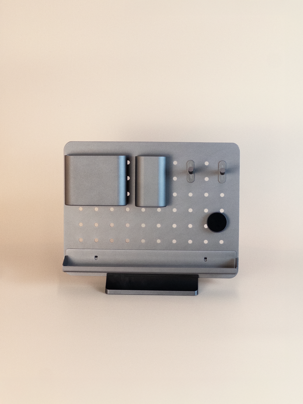Modern pegboard organizer displays on a beige background