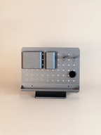 Modern pegboard organizer displays on a beige background