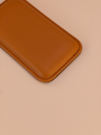 Brown leather Wrist Rest on a beige background close up look