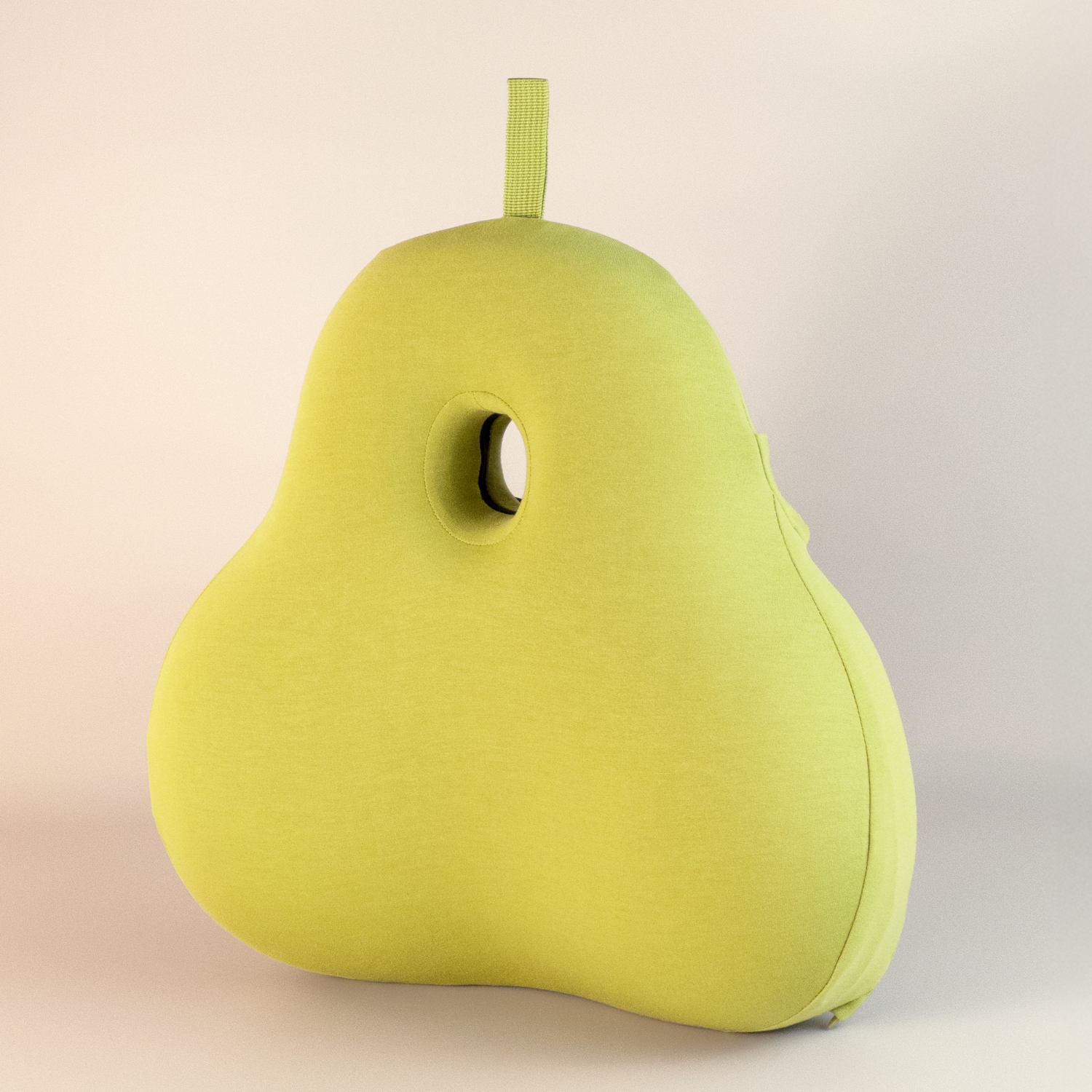 Yellow pear-shaped back support pillow on a beige background