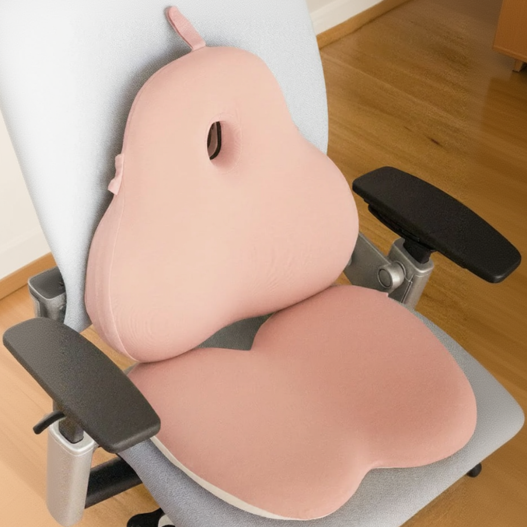Pink seat cushion on an office chair with a wooden floor background