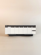 Calendar planner with pen holder on a beige background