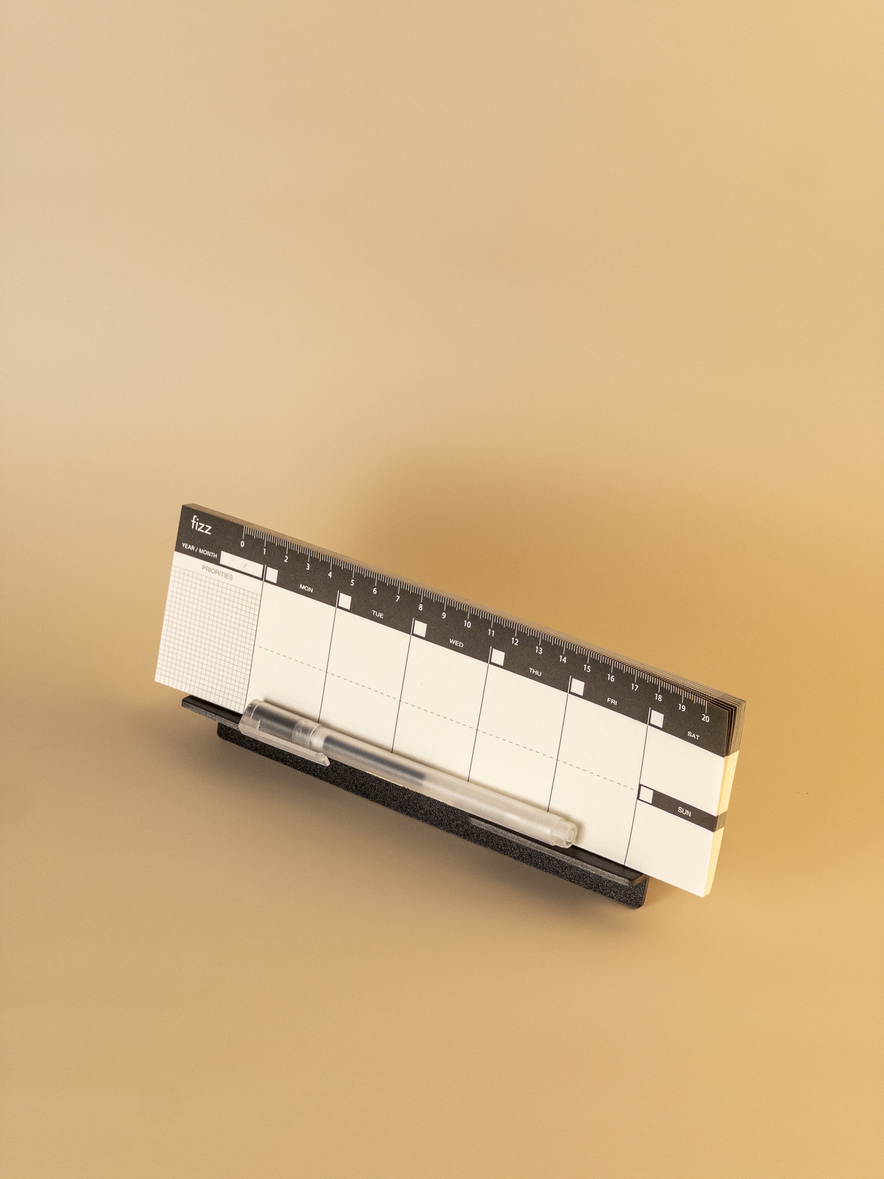 Stand-Up Weekly Planner with a pen