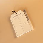 Daily schedule notepad with ring binding and pen for daily planning
