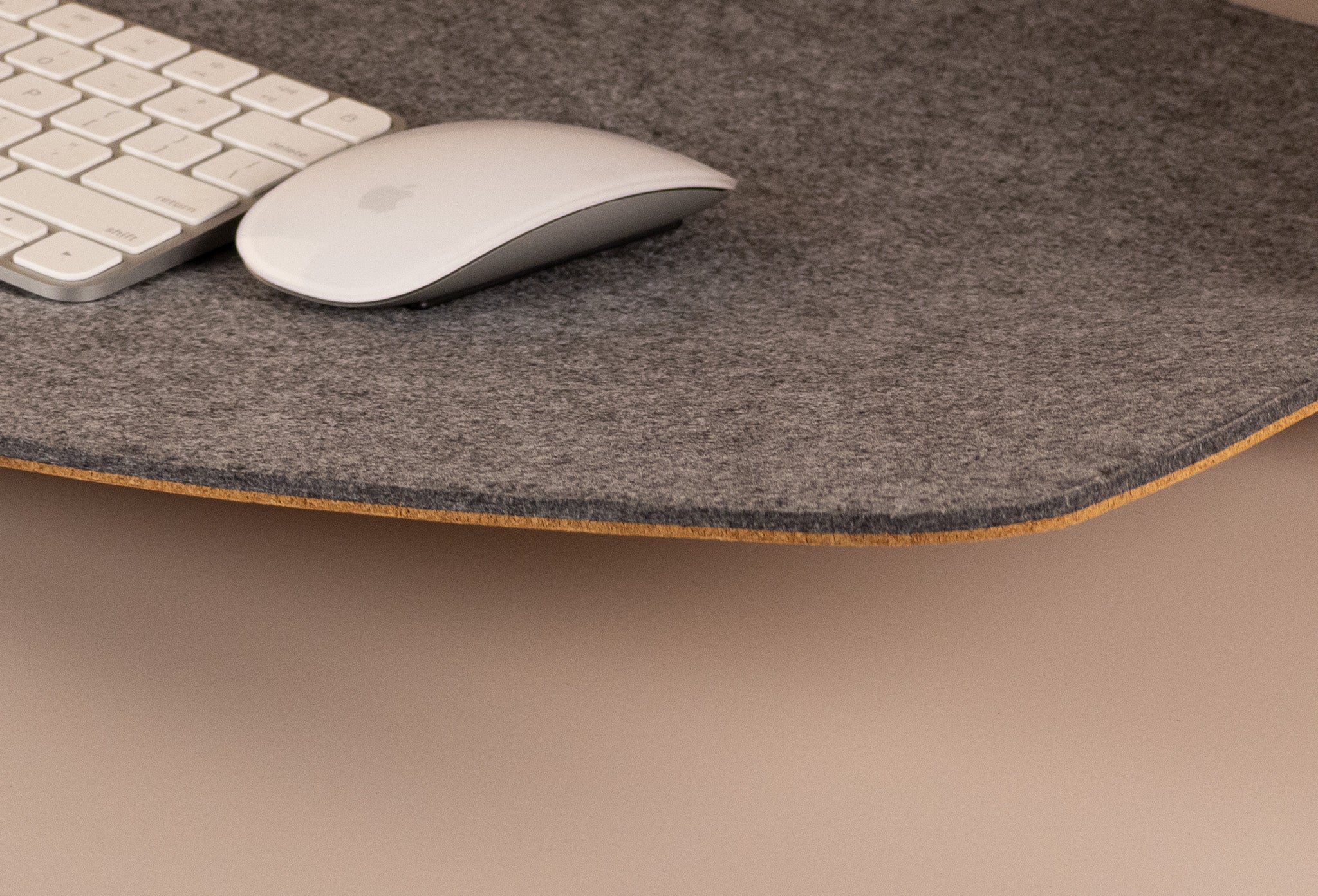 Grey felt and cork desk mat with Apple keyboard and mouse, smooth mouse tracking surface
