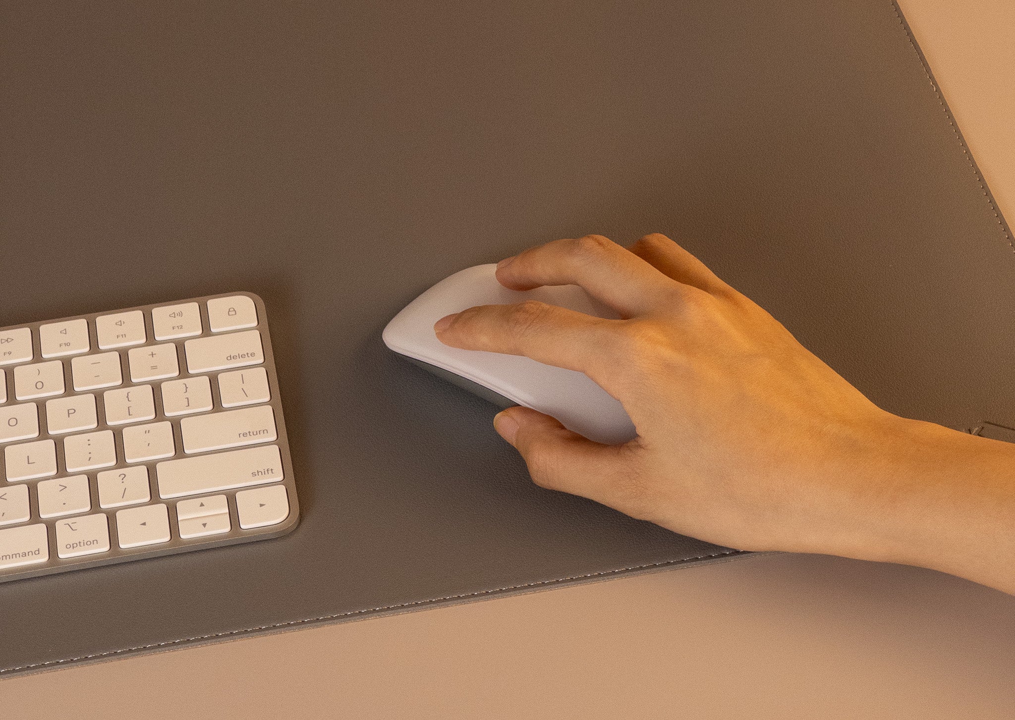 Slim grey leather desk mat with Apple keyboard and mouse, smooth surface for work and study