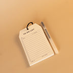 To do list notepad with black ring and pen for planning tasks